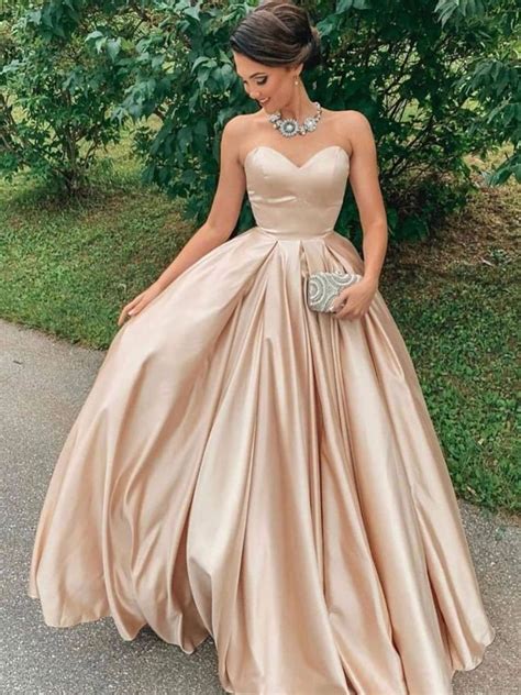 This dress by Simply has a thigh-high slit and open V-back design. . Prom gowns pinterest